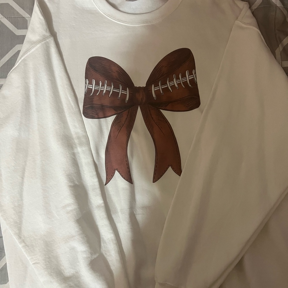 White Sweater with Football Bow Design